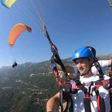 Tourism Booms and Paragliding Soars